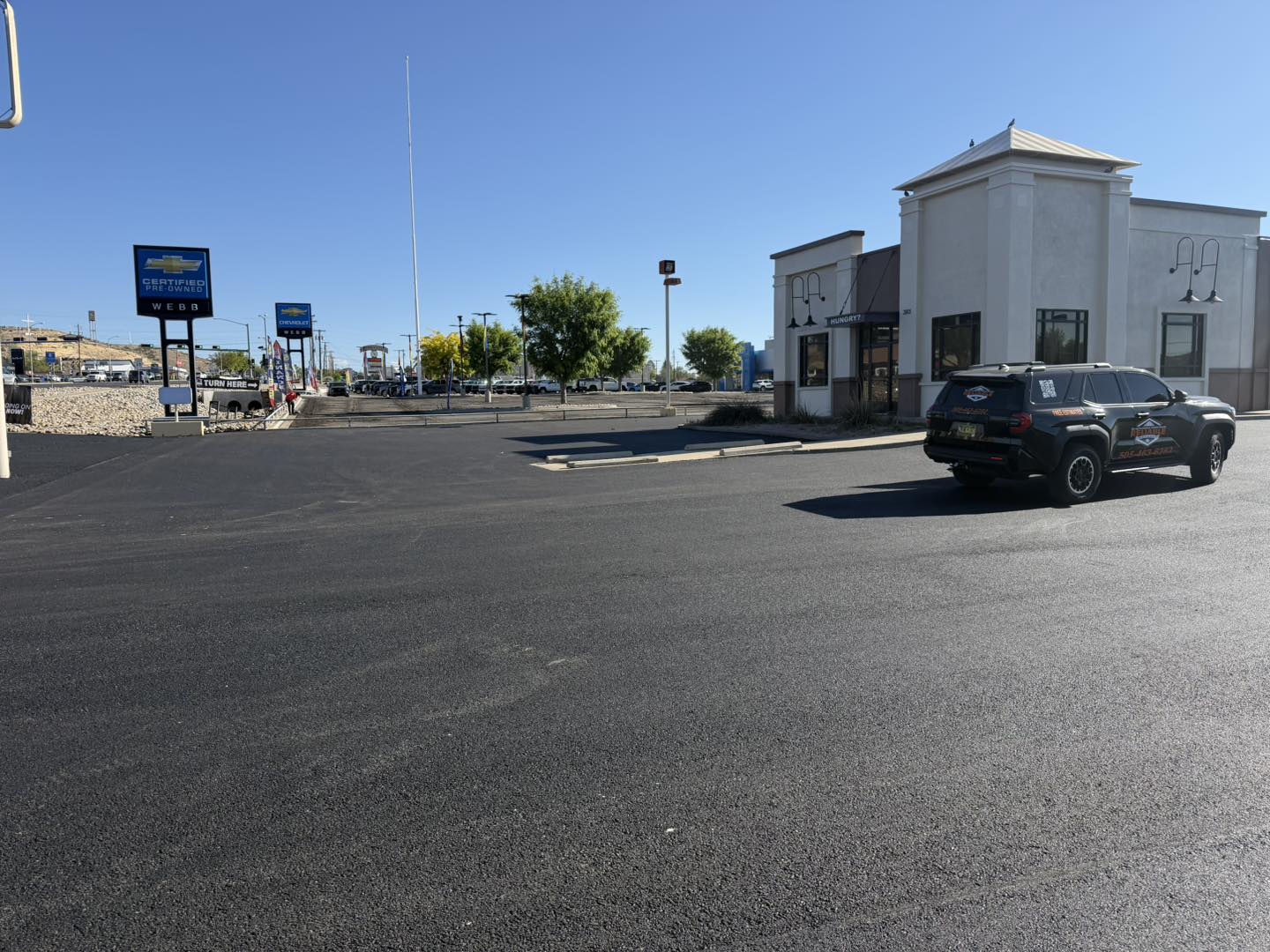 Newly paved auto dealership parking lot in New Mexico