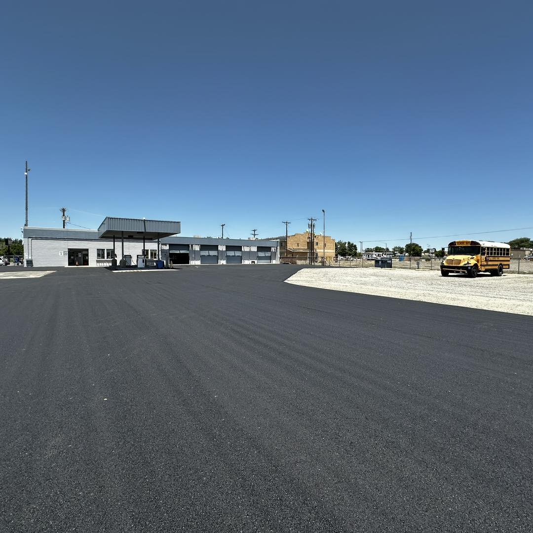 Newly paved commercial fleet lot with service bays